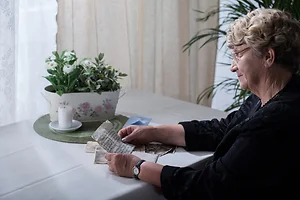 Widow looking over memorabilia
